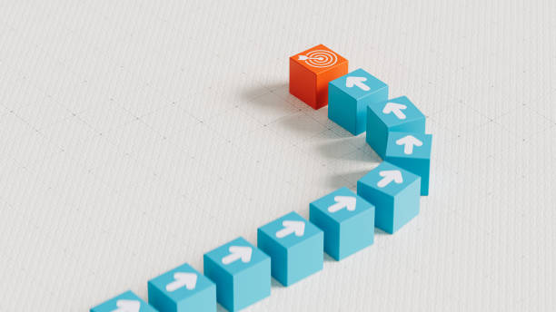 istock Cubes with Arrows Progressing Towards Goal and Target Symbol in a Linear Path - 3D Rendering 2169544187