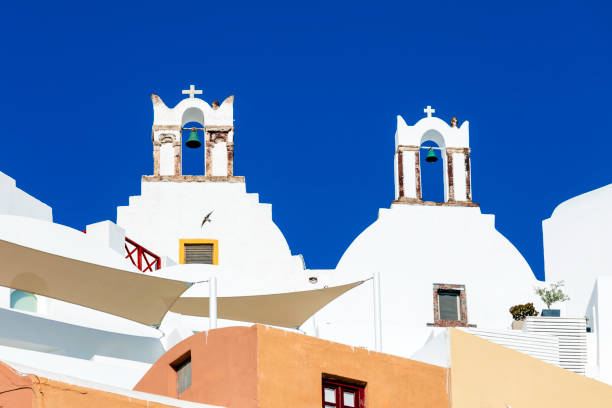 White bell towers over the mediterranean sea