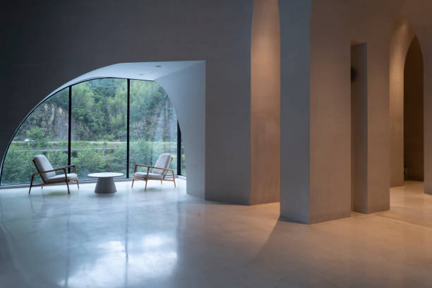 The lighting effect of an empty modern concrete curved corridor