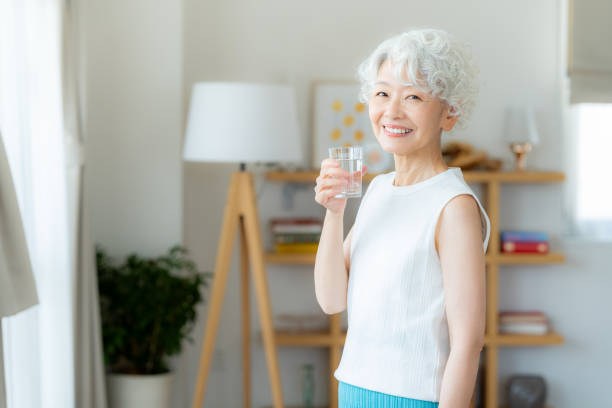 istock senior woman holding a cup 2169552056