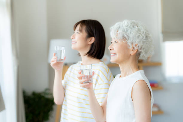 istock Parent and child holding a cup 2169552106