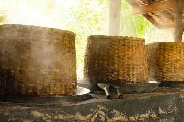 istock Asian man making boiled palm coconut sugar or cane production process  raw material  Amphawa  Thailand. Traditional culture lifestyle. Local sweet food. 2169553112