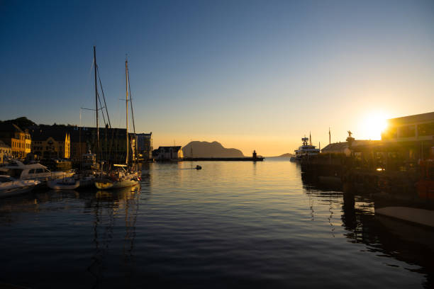 Sunset at the harbour of Ålesund, a picturesque city on Norway’s Atlantic coast. The city is nestled in the fjords of the Atlantic Ocean. This image offering a perfect glimpse of Norway’s coastal beauty.