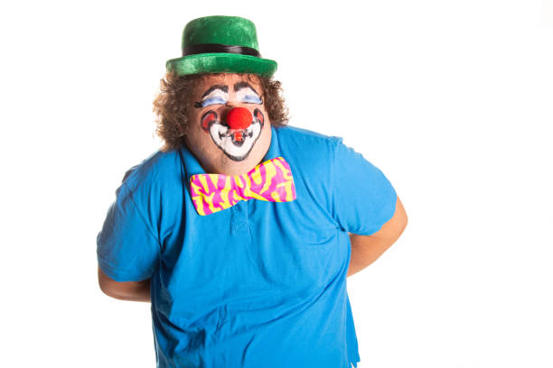 Funny fat clown posing on a white background.