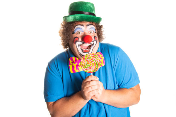 Funny fat clown posing on a white background.