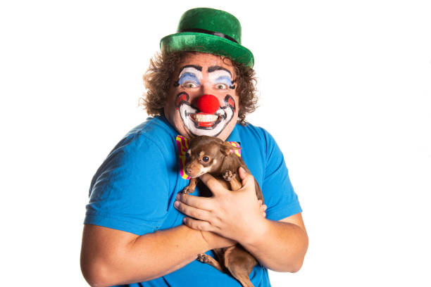 istock Funny fat clown posing on a white background. 2169561259