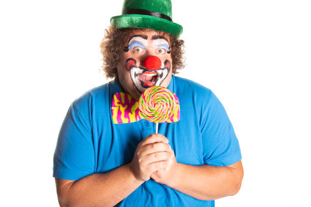 istock Funny fat clown posing on a white background. 2169561328
