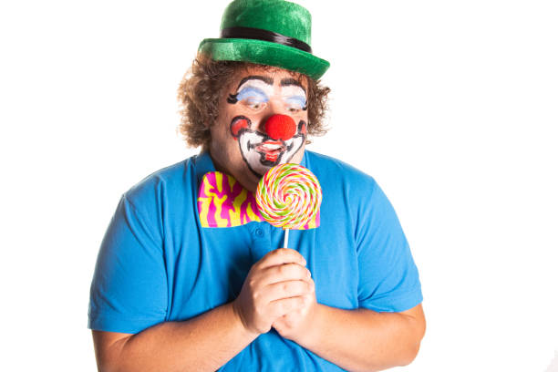istock Funny fat clown posing on a white background. 2169561420
