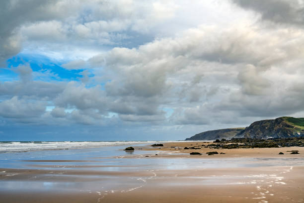 istock Cloudy skies over Cornwalls Sandymouth beach 2169561830