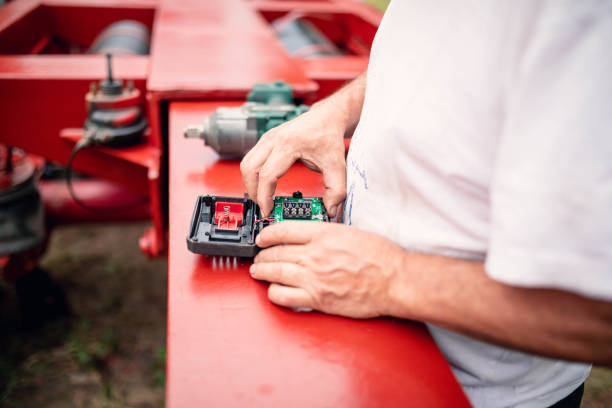 The man opened the drill to repair it.