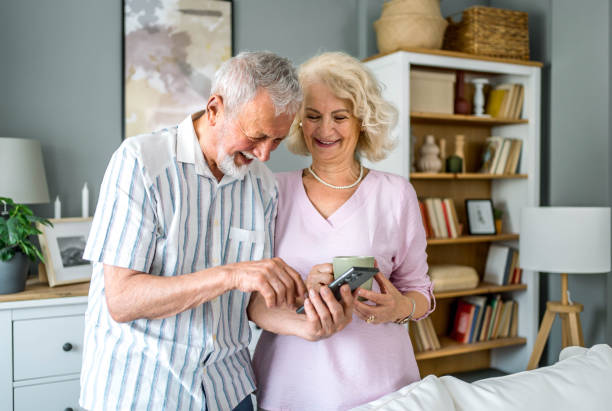 istock Senior couple using mobile phone 2169564582