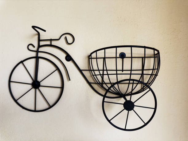 istock Metal Bicycle Wall Decor on Beige Wall Background 2169564610