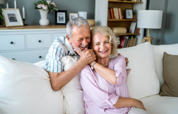 istock Senior couple relaxing together at home 2169565116