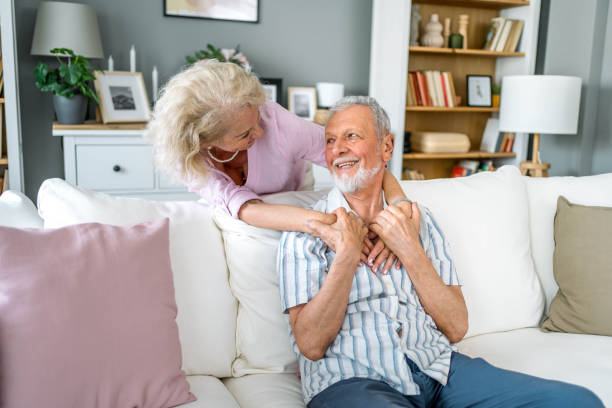istock Senior couple relaxing together at home 2169565297