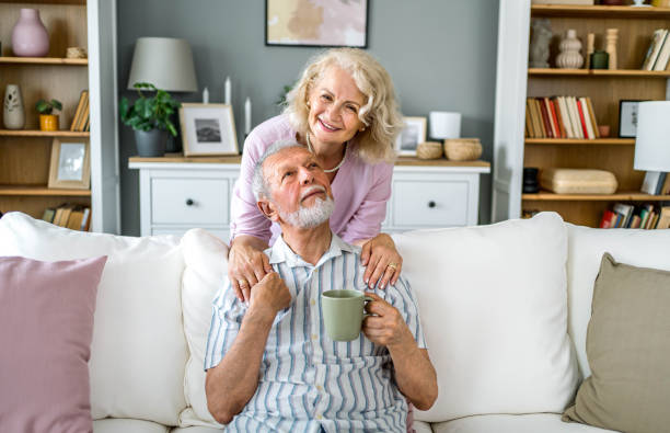 istock Senior couple relaxing together at home 2169565336