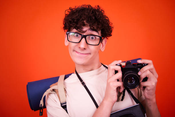 Young man making frame with hands. Young man taking picture with imaginary camera