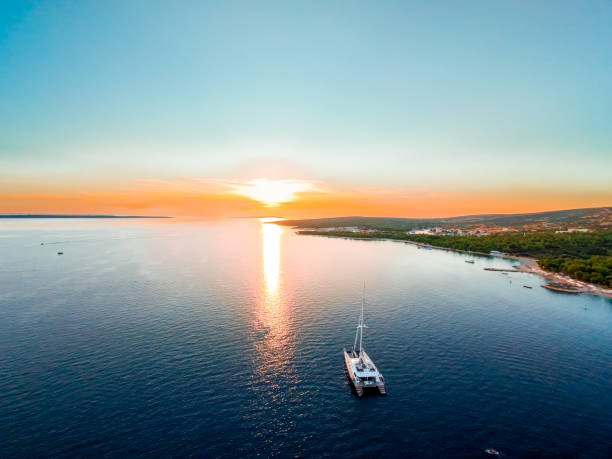 istock Blue Catamaran Anchored at Sunset in Croatia 2169565990