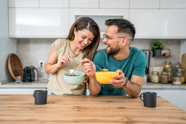 istock Young couple eating cereal breakfast 2169567153