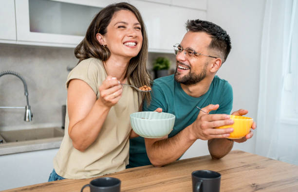 istock Young couple eating cereal breakfast 2169567291
