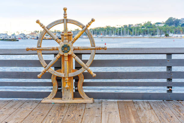 Santa Barbara, California - April 20, 2024: Vintage nautical wheel on display by the waterfront, showcasing maritime heritage at Santa Barbara Harbor, a picturesque coastal destination