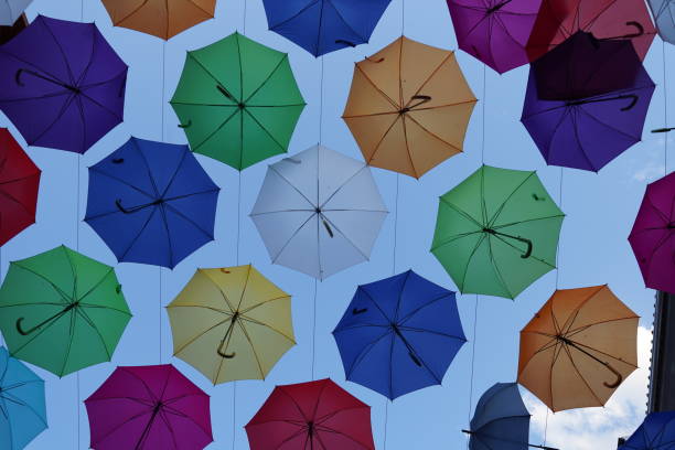 istock Umbrella hanging in a street 2169573870