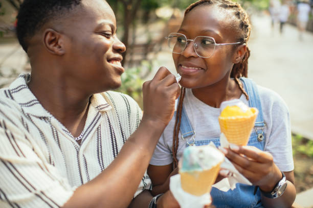 istock Young couple with ice-cream outdoors in summer 2169574699