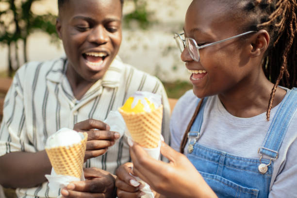 istock Young couple with ice-cream outdoors in summer 2169574833