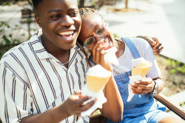 istock Young couple with ice-cream outdoors in summer 2169574836