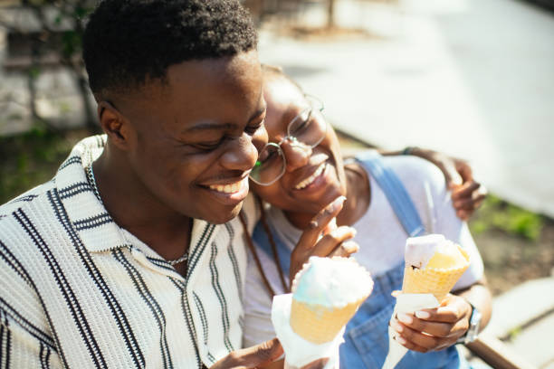 istock Young couple with ice-cream outdoors in summer 2169574837