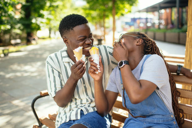 istock Young couple with ice-cream outdoors in summer 2169576034