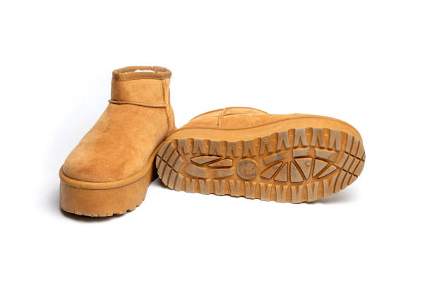 istock Womens Sheepskin boots isolated on white 2169580153
