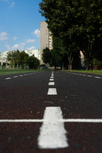 istock A rubber treadmill at the stadium. White markings. Gusty marking line 2169581662