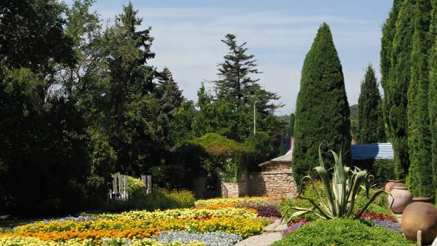 istock Park with red yellow flowers 2169583961