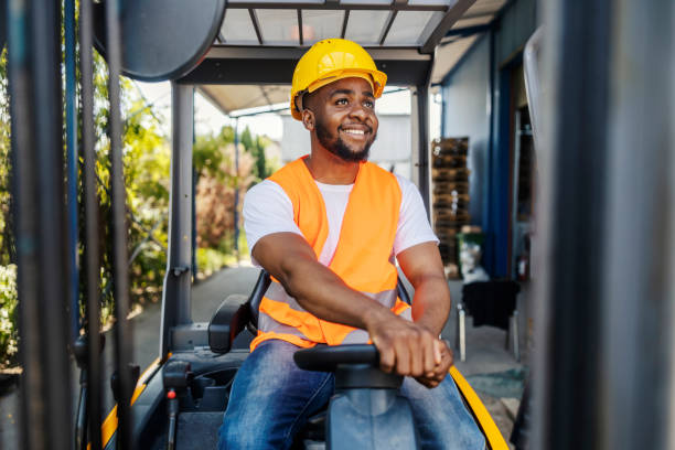 istock Portrait of diverse industry worker driving forklift. 2169584232