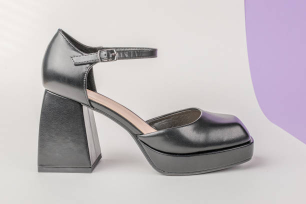Stylish Modern Black High-Heel Shoe with Ankle Strap on Light Background