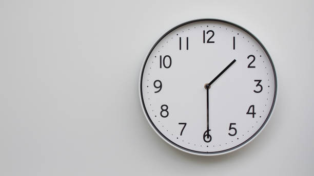 istock Minimalist Analog Wall Clock with White Face and Simple Black Hands Showing 13.30/01.30 - Ideal for Time Management and Modern Decor Concepts 2169588774