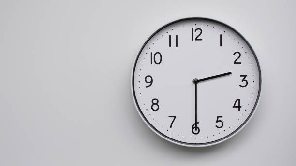 istock Minimalist Analog Wall Clock with White Face and Simple Black Hands Showing 14.30/02.30 - Ideal for Time Management and Modern Decor Concepts 2169588789