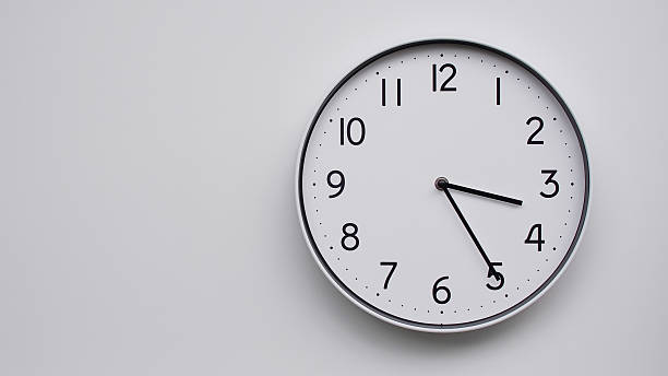 istock Minimalist Analog Wall Clock with White Face and Simple Black Hands Showing 15.25/03.25 - Ideal for Time Management and Modern Decor Concepts 2169588808