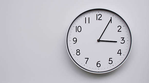 istock Minimalist Analog Wall Clock with White Face and Simple Black Hands Showing 15.05/03.05 - Ideal for Time Management and Modern Decor Concepts 2169588809