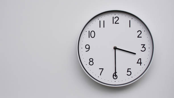 istock Minimalist Analog Wall Clock with White Face and Simple Black Hands Showing  - Ideal for Time Management and Modern Decor Concepts 2169588841