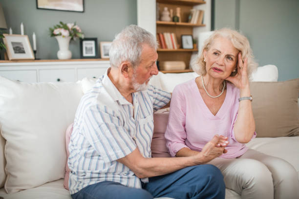 istock Senior man calming down his depressed wife 2169604089