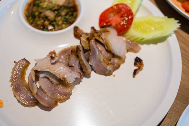 Thai grilled pork neck with spicy dipping sauce. Thai food style