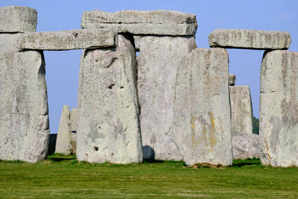 Stonehenge, Wiltshire, United Kingdom, August 30, 2024. Atmospheric ancient neolithic stone circle or monument. View though outer sarsen stones to inner bluestones. Sunny summer day outdoors