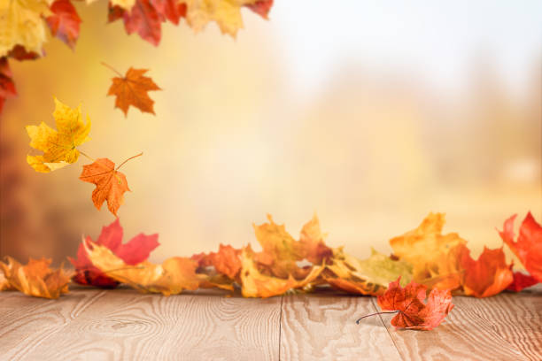 Falling autumn leaves on the table