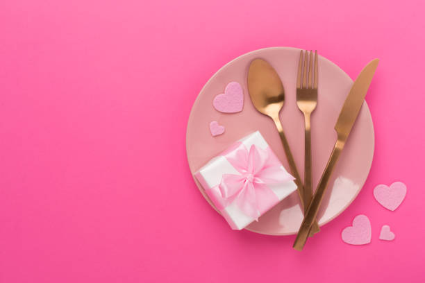 istock Festive table setting for Valentine's Day on color background, top view 2169617849