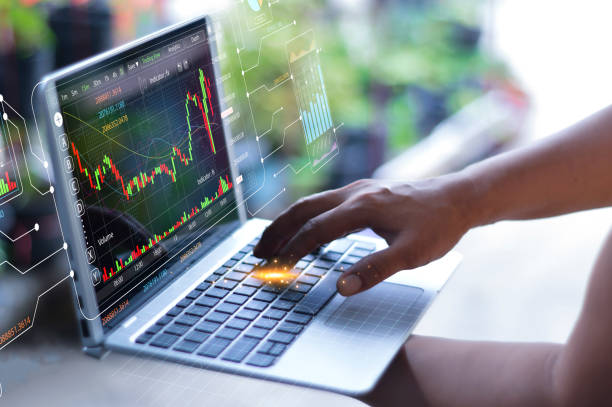 istock data analysis trading ideas Businessman working with data chart with AI Robot showing the use of artificial intelligence in investment trading. digital transformation technology 2169620600