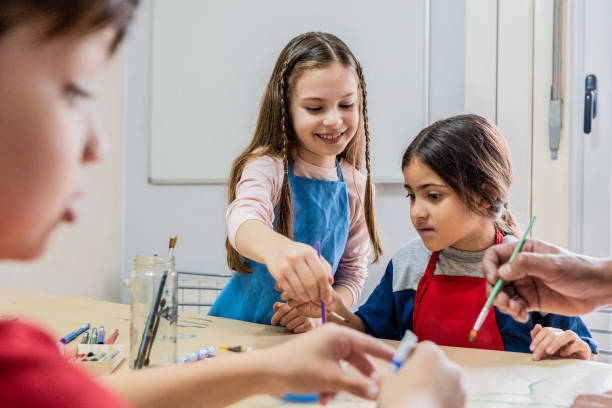istock Children doing painting activity at school 2169624658