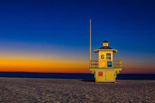 Lifeguard tower, art deco design, Clearwater Beach, Florida, early evening in December, Gulf of Mexico in the background, sunset glowing