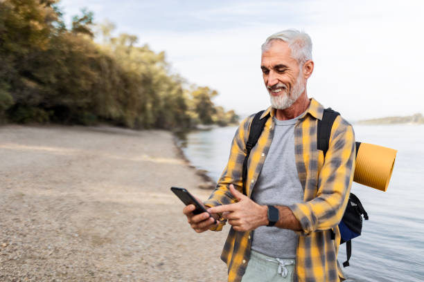 istock Autumn Riverbank Hike with Phone in Hand 2169627977
