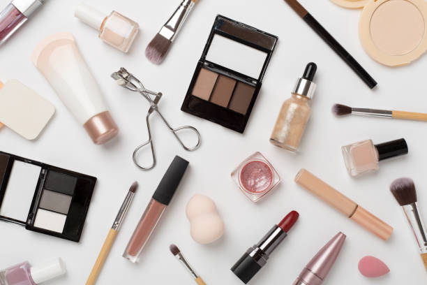 istock Flat lay with makeup products and tools on color background 2169629235